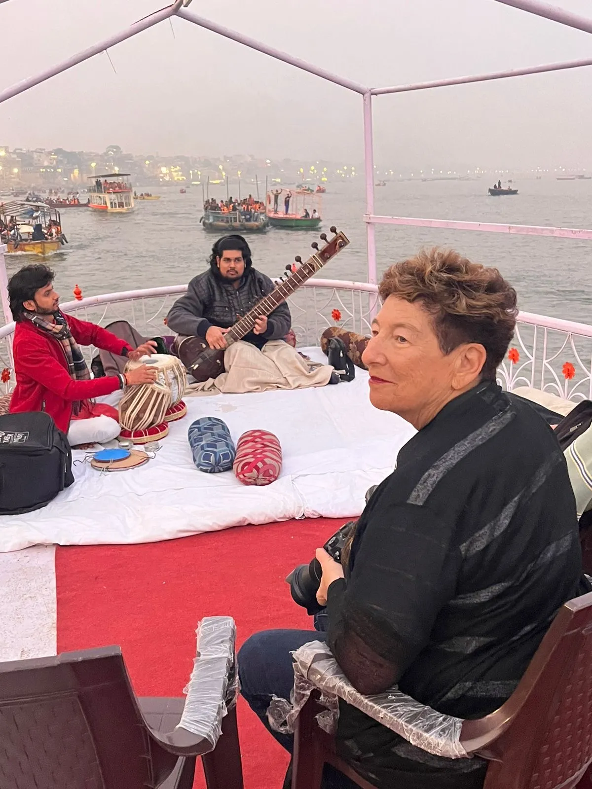 Person with marigold garland